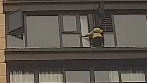 Chinese girl rescued after being stranded on window ledge