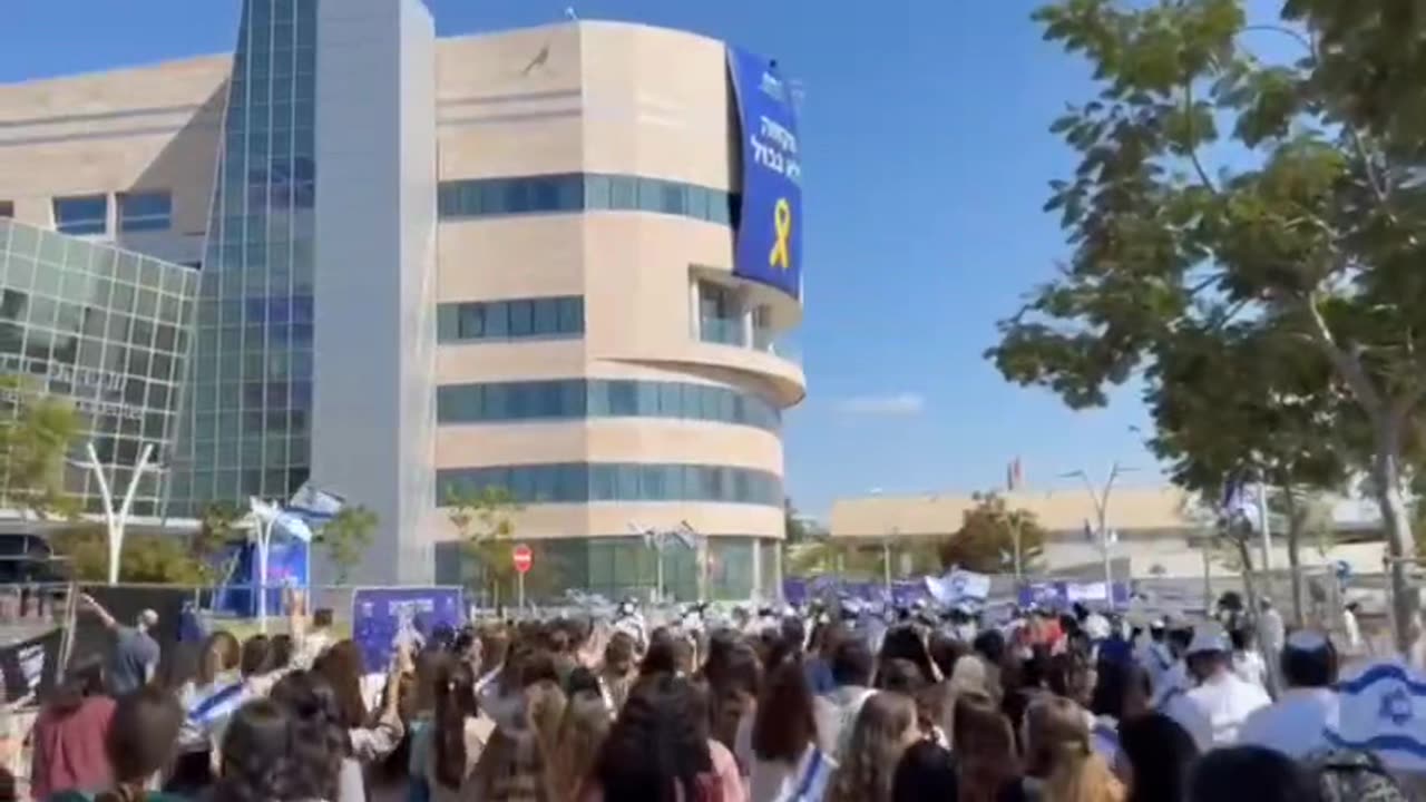 Israelis outside Hospital Shiba where some released hostages stay.