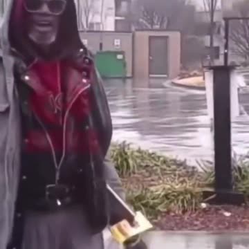 Beggar gets angry when given money, throws it back, man gets out of car