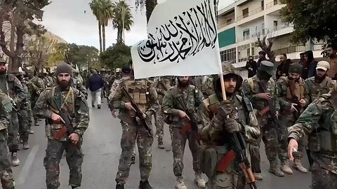 Hundreds of Syrian armed rebels parade in Damascus as a show of force