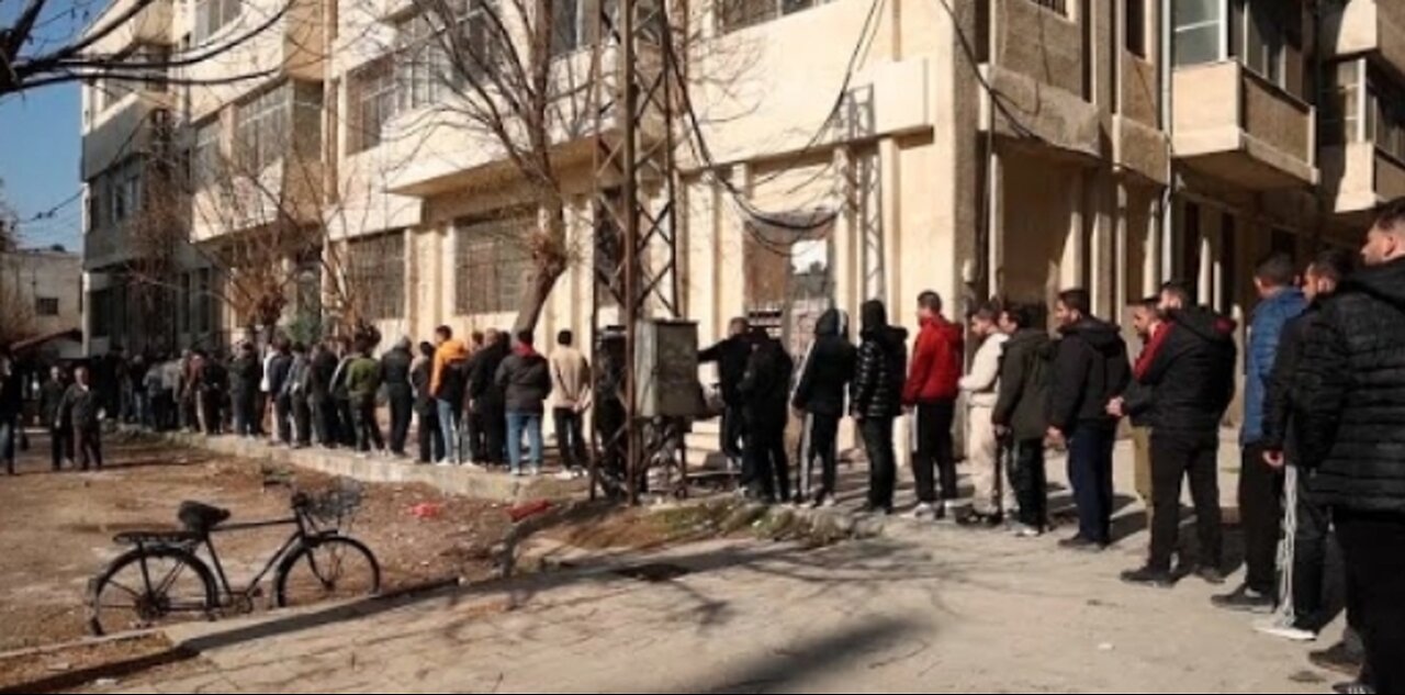 Former Syrian army soldiers line up to reconcile status with new government