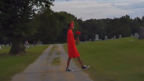 Joe Winko walking through a cemetery