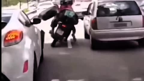 TWO MOTORCYCLISTS FALL IN THE MIDDLE OF A BUSY STREET