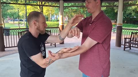 Val and Steven practice Chi Sau