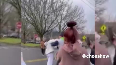 An Eastside mother was brutally assaulted Monday morning by a mob of Issaquah High School students