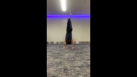 handstand fitness session at the airport