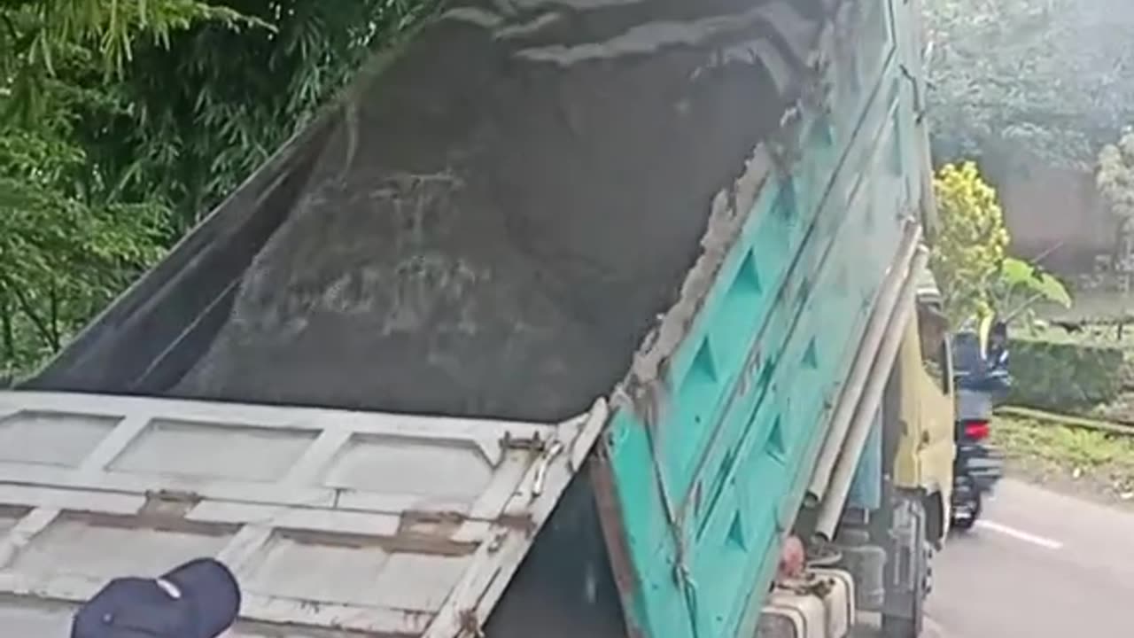 The truck is unloading sand from Mount Merapi