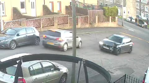 Driver Speeds Around Corner and Collides With Streetlight