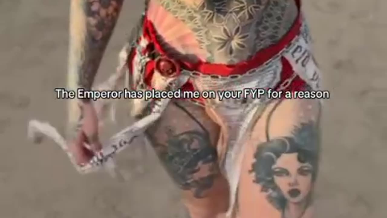 Full body tattoos show off her style.