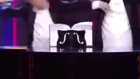 Zelinsky playing piano with his . .