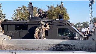 Armored vehicle rolls past protestors outside suburban Chicago ICE facility