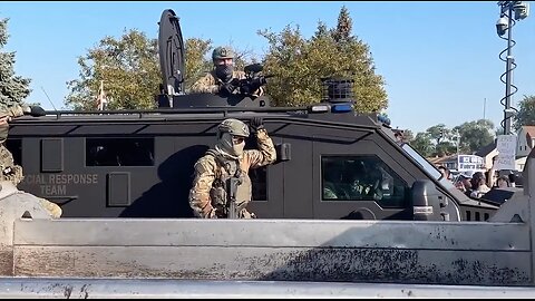 Armored vehicle rolls past protestors outside suburban Chicago ICE facility