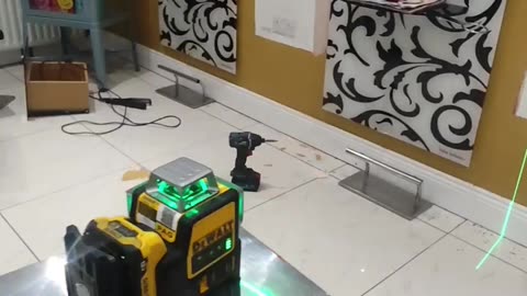 DeWalt laser level is used to fit and level the drawer in the hair salon , great visible lines