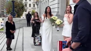 California Governor Gavin Newsom “accidentally” crashes the wedding of two queers outside