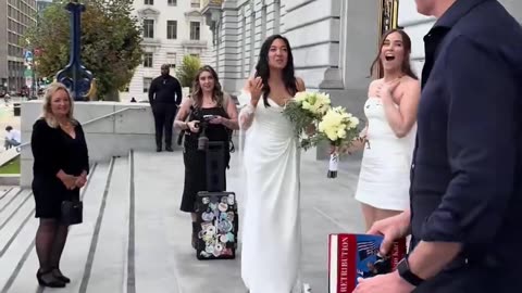 California Governor Gavin Newsom “accidentally” crashes the wedding of two queers outside