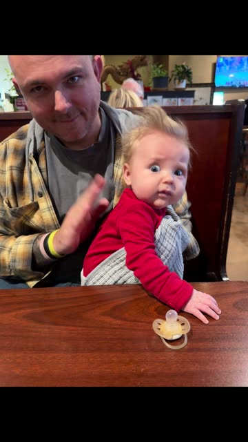 Concerned Baby Being Burped