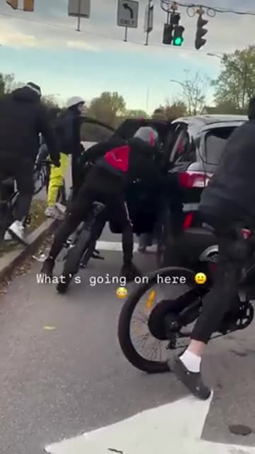 Terrified Mother drives off after being surrounded by a gang of youths who tries to get in the car