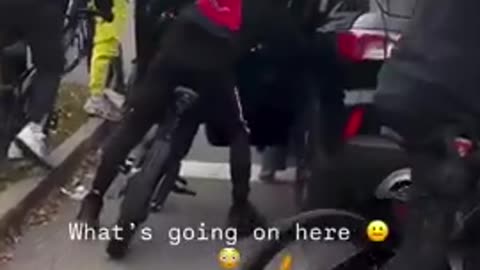 Terrified Mother drives off after being surrounded by a gang of youths who tries to get in the car