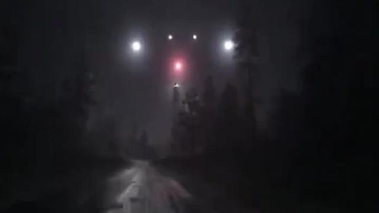 A large triangular 🔻🔺️ UFO over the forest at night, presumably an TR3 Black Manta.