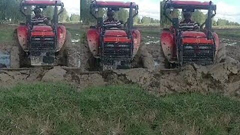 Machinery Kubota Tractor Pushing Mud