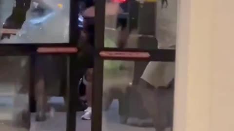 Drunk guy kicks in hotel front door