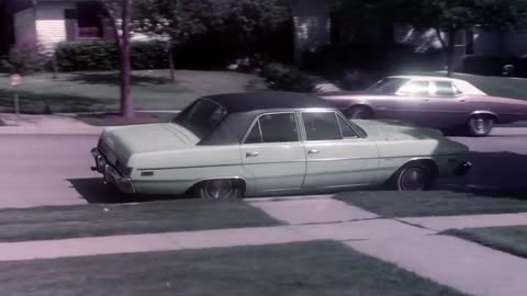 1976 Dodge Dart driving away.