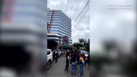 People gather outside after big quake hits southern Philippines