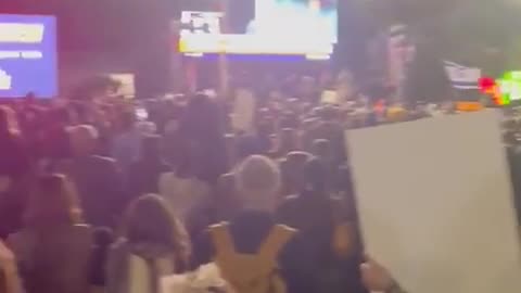 Israelis cheer and celebrate at the news that Romi, Emily, and Doron are coming