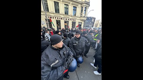 Police reinforcements arrive at Checkpoint Charlie after trouble erupted in Berlin