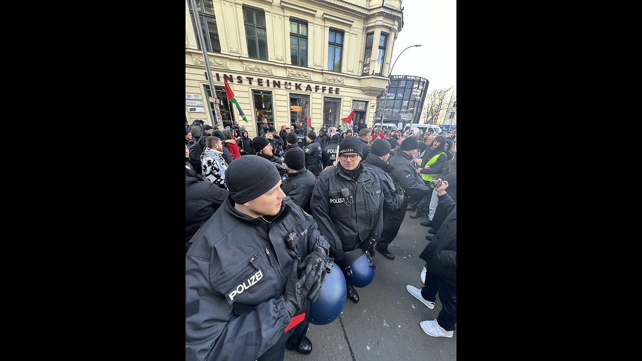 Police reinforcements arrive at Checkpoint Charlie after trouble erupted in Berlin