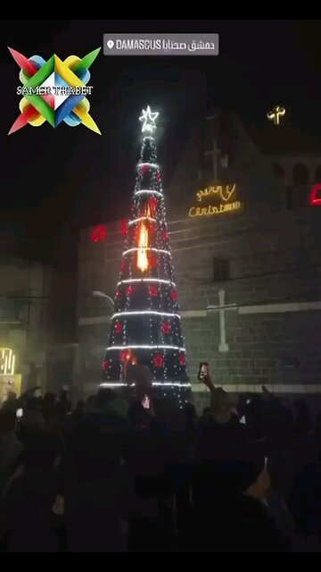 The moment terrorists from Syria and Turkey burned down a Christmas tree in front of a Church