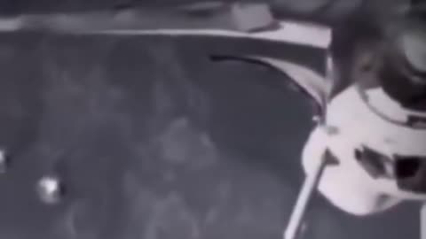 Two circular objects were filmed by NASA near NSI-1360 during orbital servicing.