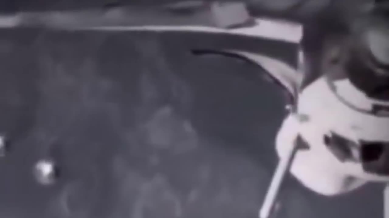 Two circular objects were filmed by NASA near NSI-1360 during orbital servicing.