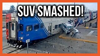 Train Smashes Vehicle After Driver Backs SUV into Barrier