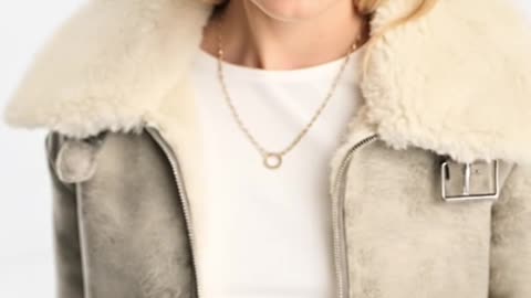 The Distressed Shearling Bomber That Redefines White Luxe
