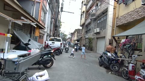 Kids Are Playing on Lt. Garcia Street in Paranaque City in the Philippines