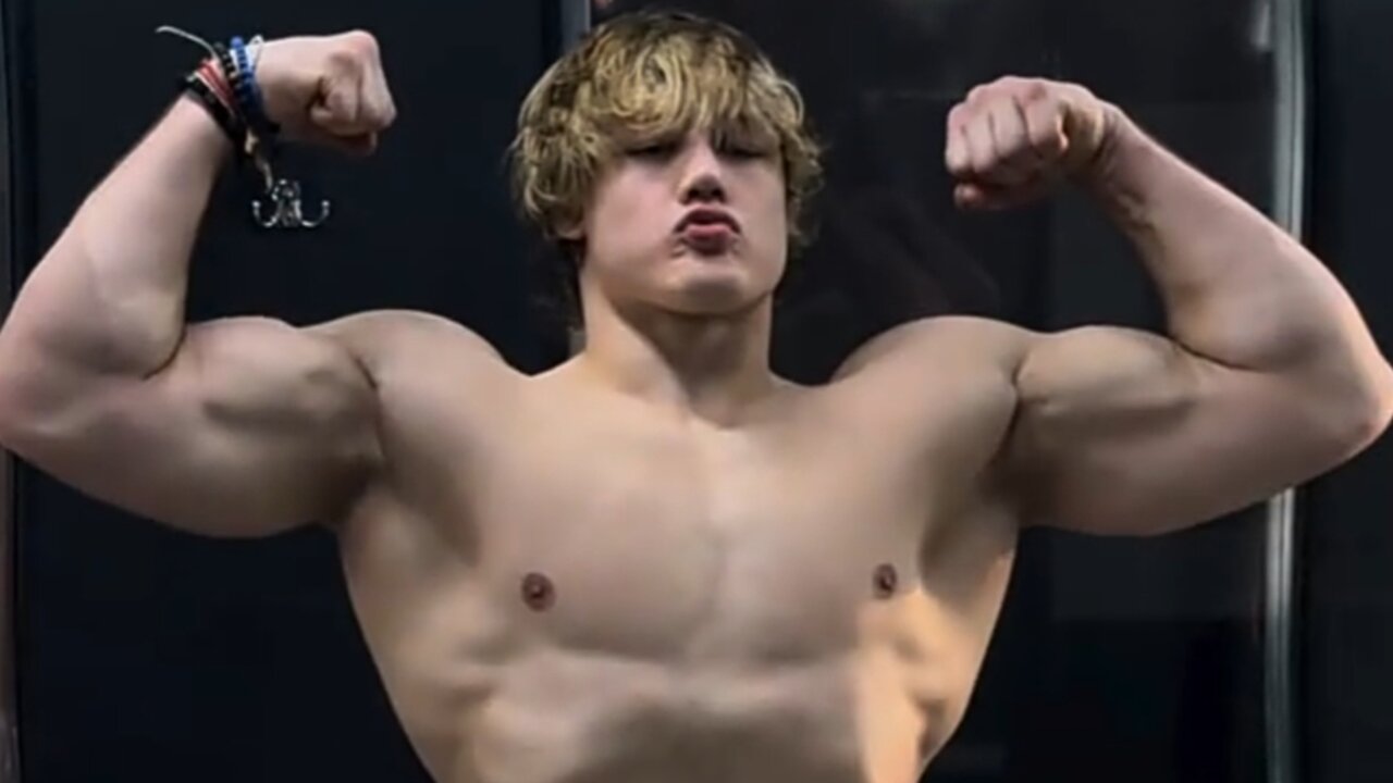 Handsome muscular guy showing off his muscles