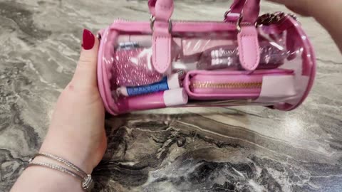 Requested 12 must haves in my bag. Packing my clear Steve Madden.