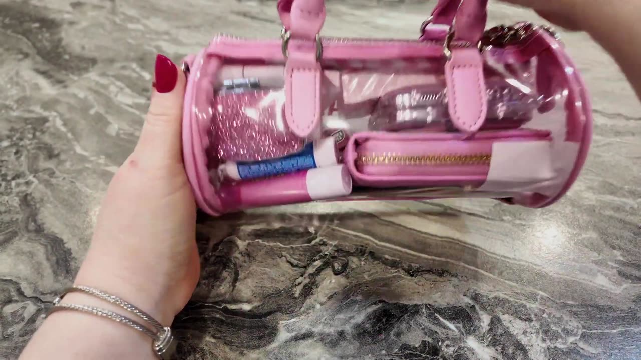 Requested 12 must haves in my bag. Packing my clear Steve Madden.
