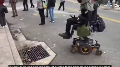 Paid Rioters - Wheelchair bound ICE protester seems to temporarily have a divine intervention