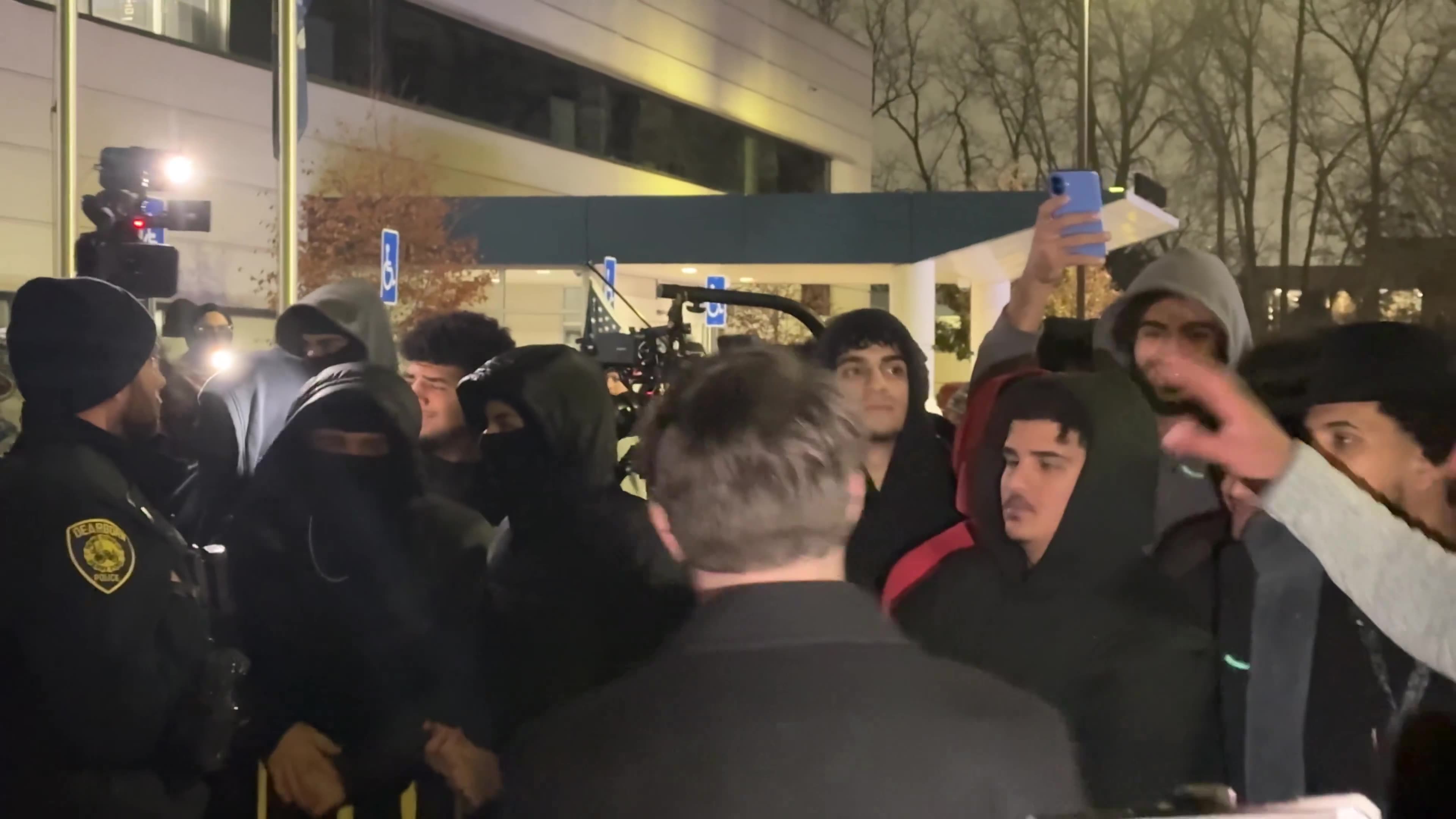 Even after he was brought into safety, people continued to shout profanities at him.