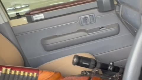 What gear does Tim carry when hunting in Africa?