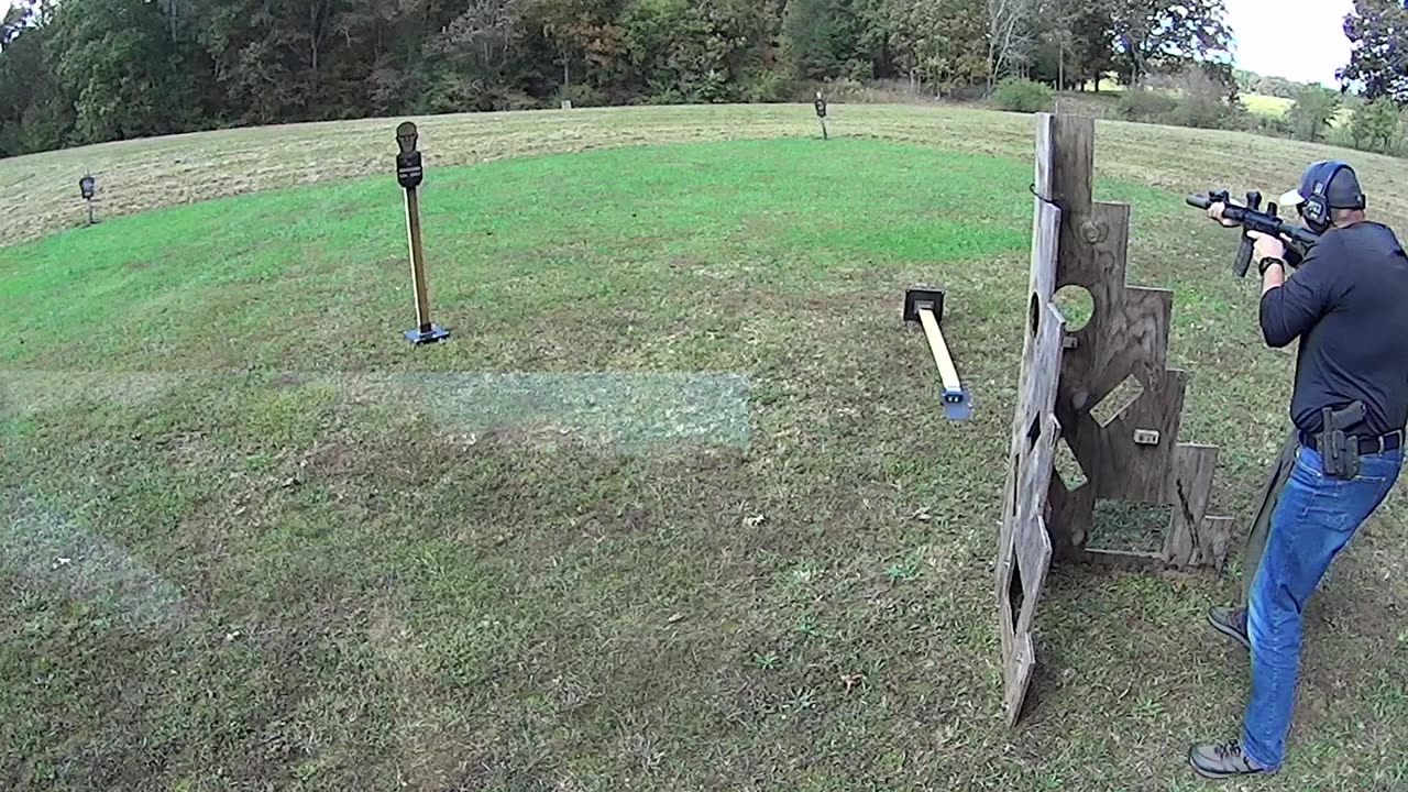 G17 & Suppressed Rifle At Barrier