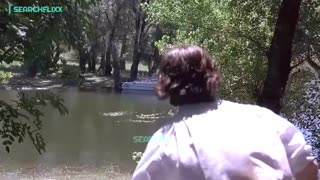 He watches his wife getting a little too close to the water-ski instructor 😬