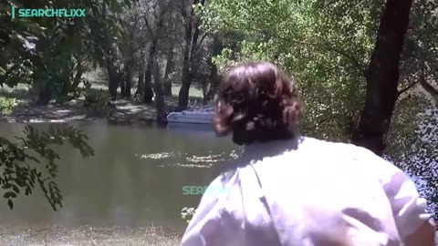 He watches his wife getting a little too close to the water-ski instructor 😬