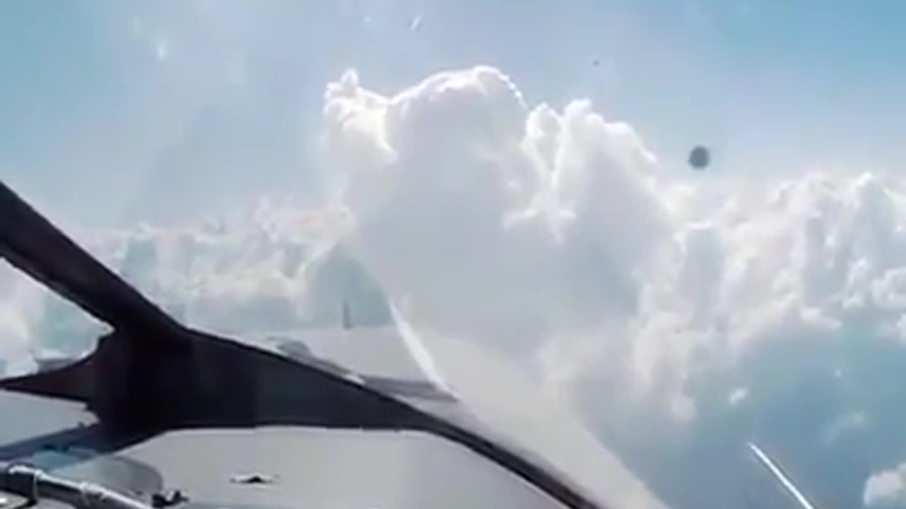 UFO sighting in front of flying airplane over Kansas, USA. Recorded on April 28, 2019.