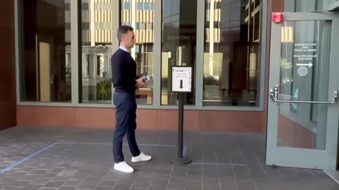 Don Lemon's husband, Tim Malone, waiting to go through security at downtown LA courthouse