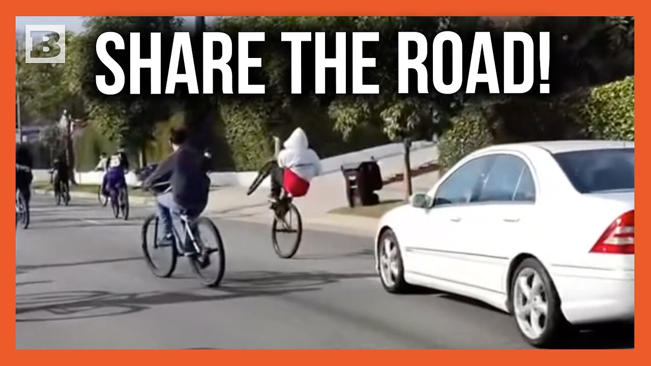 Driver Weaves Dangerously Through Massive Pack of Bicycles on Road