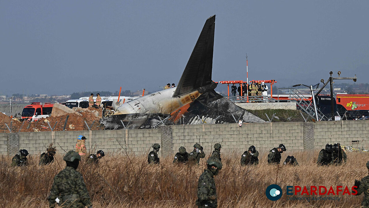 Rescuers pull people out of plane after fatal accident at a South Korean airport