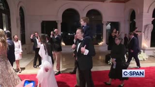 Elon Musk and his son Lil X at Trump's New Year's Eve party at Mar-a-Lago.